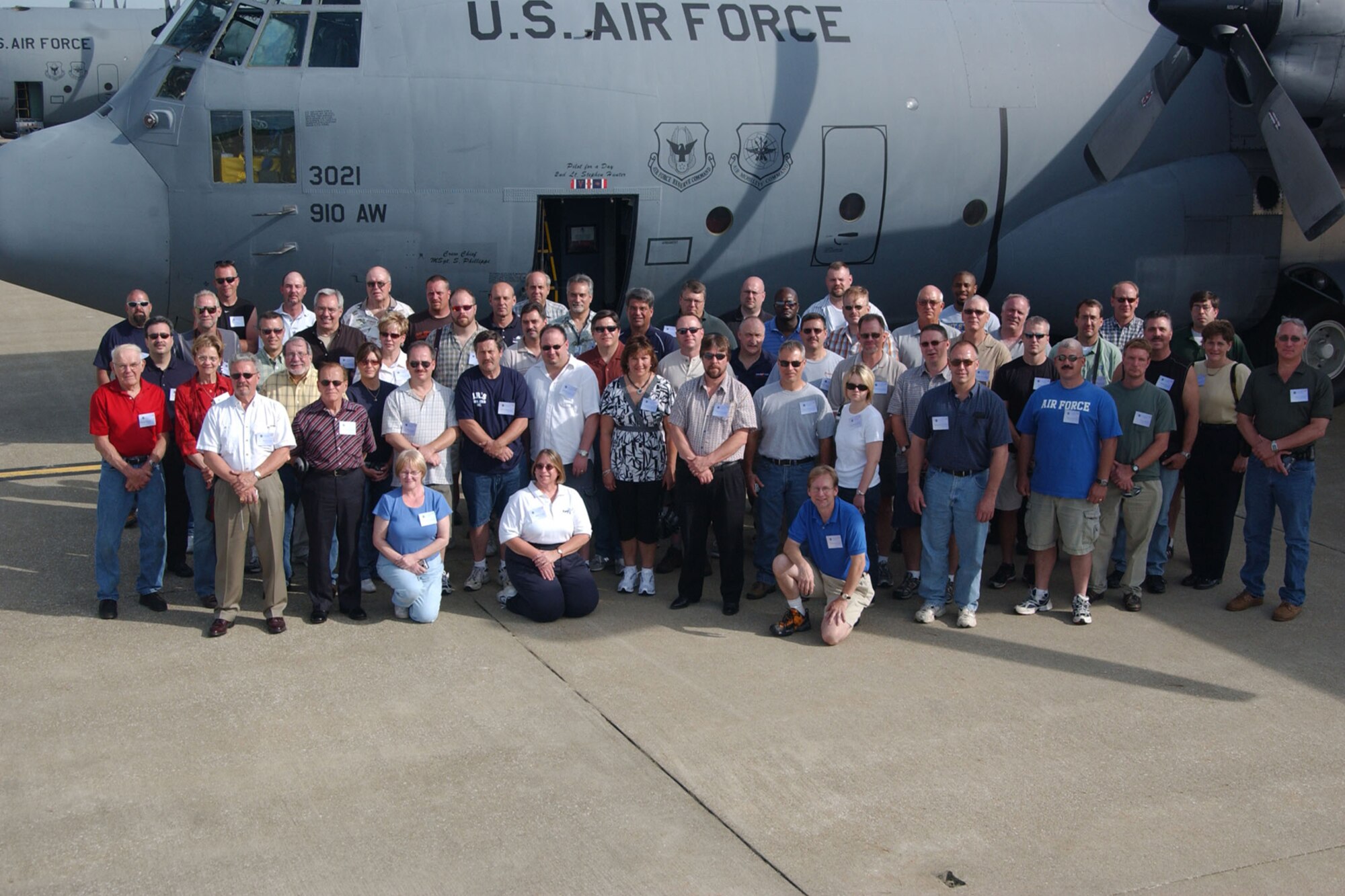 YOUNGSTOWN AIR RESERVE STATION, Ohio -- Employers of local Air Force Reservists enjoy a group photo opportunity in front of a C-130 Hercules June 7, here as part of the 910th Airlift Wing's Employer Awareness Day. The event is designed to increase the awareness of civilian employers about the Air Force Reserves mission. U.S. Air Force Photo/Senior Airman Clinton E. Kline.                               