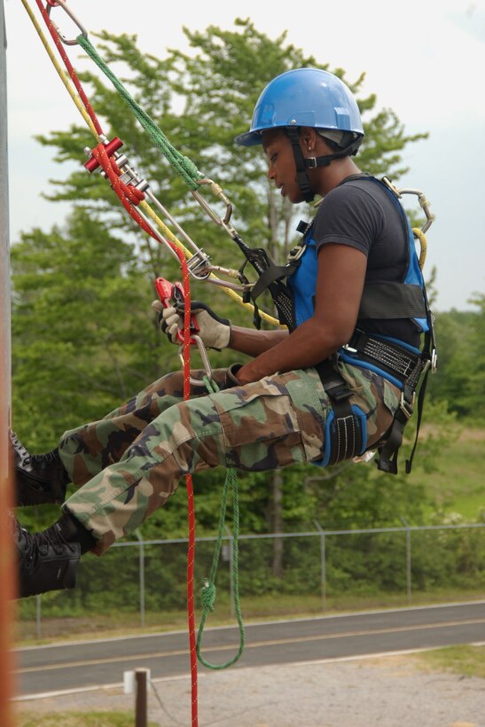 YOUNGSTOWN AIR RESERVE STATION, Ohio --  Air Force Reserve Senior Airman Nikela Howze, a fire fighter assigned to the 910th Civil Engineer Squadron, prepares to rapel down a wall of a building at the fire fighter training facility here during Employer Awareness Day, June 7. U.S. Air Force Photo/Senior Airman Clinton E. Kline.                              