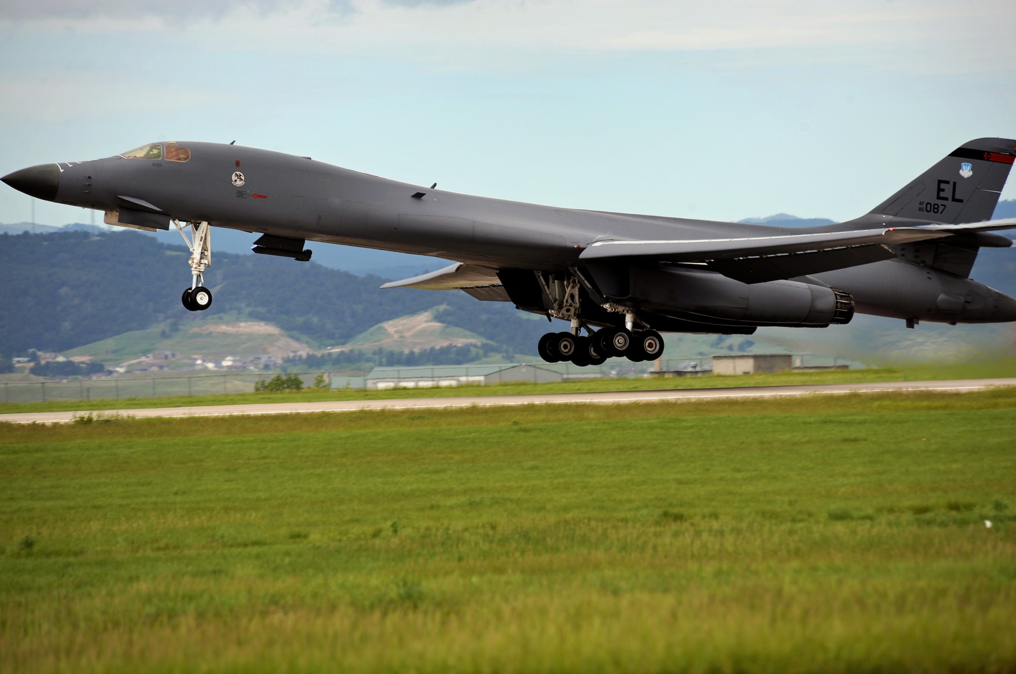 The first 28th Bomb Wing B-1B Lancer equipped with a Sniper Advanced Targeting Pod takes off of the flight line, June 10. The Sniper ATP is a long-range precision targeting system that supports strike missions by providing positive target identification, autonomous tracking, coordinate generation and accurate weapons guidance from extended standoff ranges. (U.S. Air Force photo/Senior Airman Marc I. Lane)
