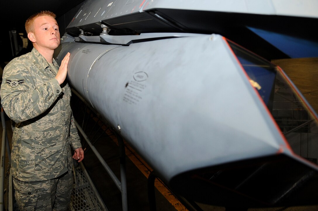 Airman 1st Class Justin Lane, 28th Aircraft Maintenance Squadron offensive avionics systems journeyman, checks the sway brake positioning on a Sniper Advanced Targeting Pod equipped on a 28th Bomb Wing B-1B Lancer in hanger 74, June 5. The Sniper ATP is a long-range precision targeting system that supports strike missions by providing positive target identification, autonomous tracking, coordinate generation and accurate weapons guidance from extended standoff ranges. (U.S. Air Force photo/Senior Airman Marc I. Lane)
