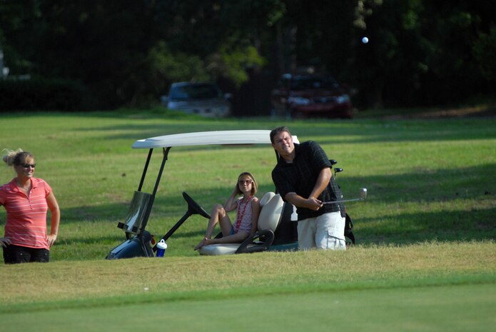 Nicholas Rawlings chips onto the green at the fifth hole at the Wrenwoods Golf Course June 9. (U.S. Air Force photo/Senior Airman Sam Hymas)