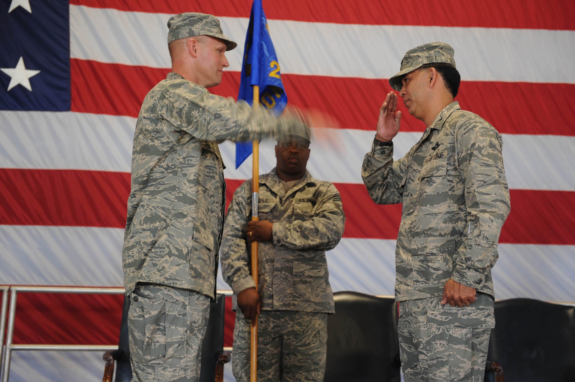 SHAW AIR FORCE BASE, S.C. -- Col. James Post, 20th Fighter Wing commander, returns a salute to Col. Ted Uchida, 20th Mission Support Group commander, during the 20th MSG Change of Command ceremony recently at Shaw. Chief Master Sgt. Arnell Credle, 20th MSG chief enlisted manager, secures the guidon. (U.S. Air Force photo/Staff Sgt. Henry Hoegen)