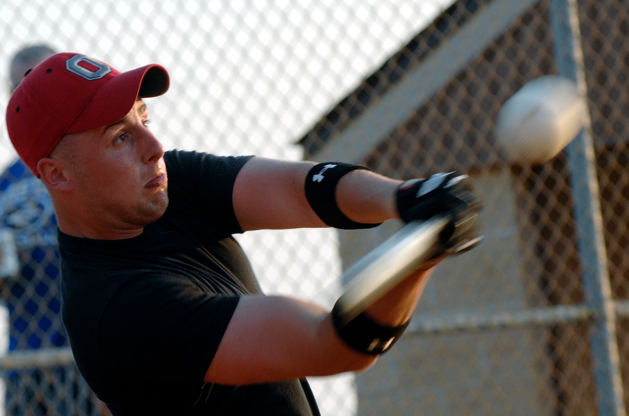 LANGLEY AIR FORCE BASE, Va. --  Airman 1st Class John DeCola, 1st Civil Engineer Squadron, takes a swing during a national league softball game June 9.  The 1st CES defeated 1st LRS 18-14.  (U.S. Air Force photo/Senior Airman Vernon Young)