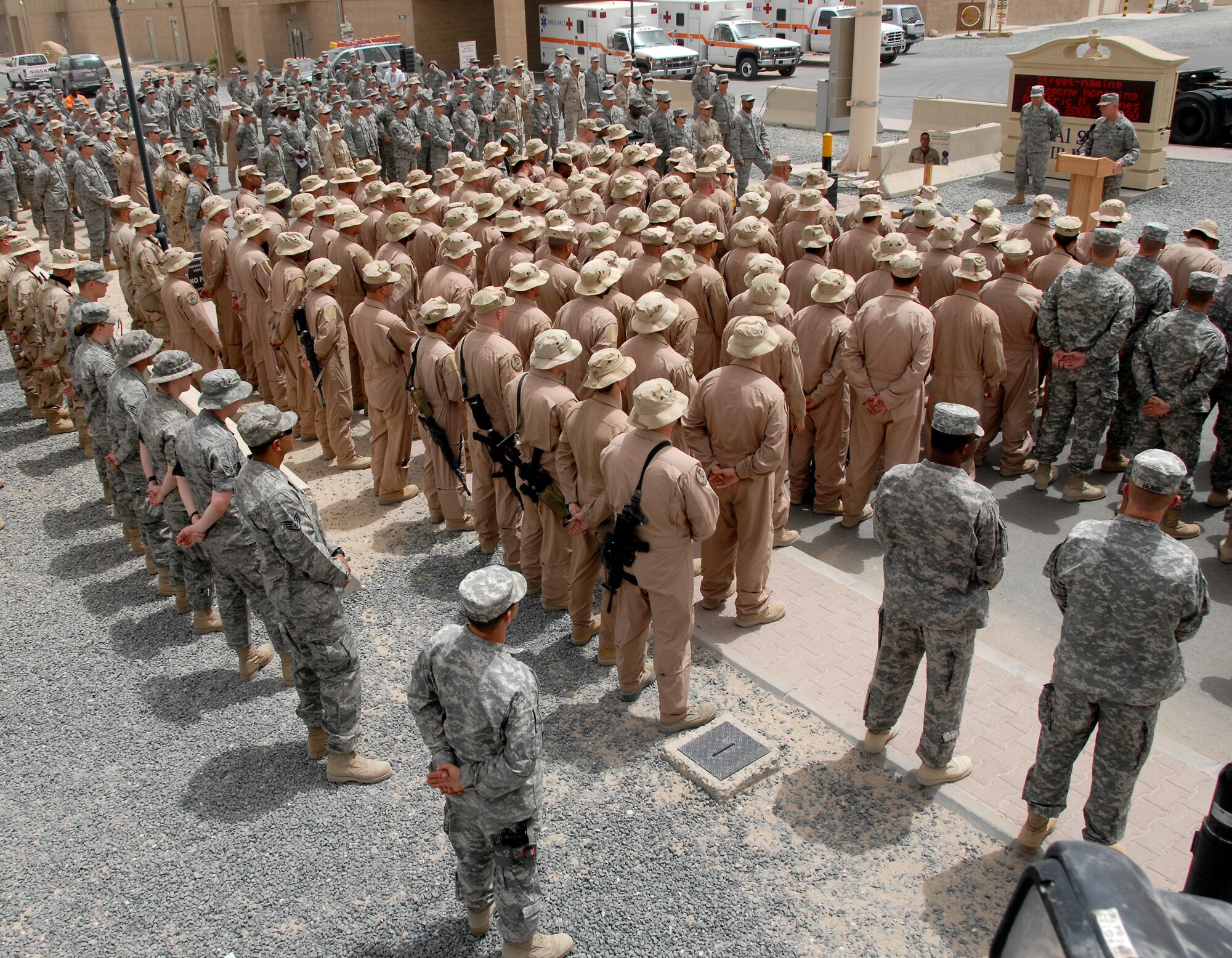 SOUTHWEST ASIA -- Colonel Robert Swisher, 386th Air Expeditionary Wing commander, provides some opening remarks about Airman 1st Class Eric Barnes prior to the unveiling of a street sign in his honor June 10, 2008, at an air base in the Persian Gulf Region. The street dedication ceremony is a tribute to Airman Barnes and his family with the naming of Barnes Road. Airman Barnes, 20, of Lorain, Ohio, died June 10, 2007 as a result of an improved explosive device attack on an Air Force convoy about 100 miles south of Baghdad, Iraq. He was deployed from the 90th Logistics Readiness Squadron at F.E. Warren Air Force Base, Wyo.  (U.S. Air Force photo/ Tech. Sgt. Michael O'Connor)  