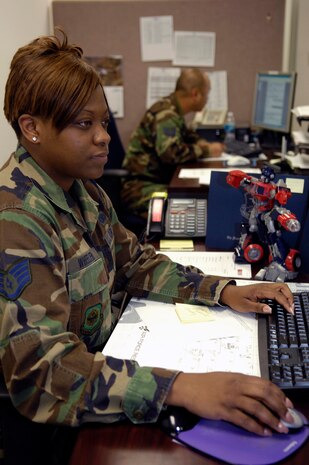 Staff Sgt. Juronda Wheeler reviews personnel records at the Military Personnel Flight at Charleston AFB June 5 at 11:09 a.m., 1509 ZULU. Sergeant Wheeler is a personnel specialist with the 437th Force Support Squadron. (U.S. Air Force photo/Senior Airman Ali E. Flisek)