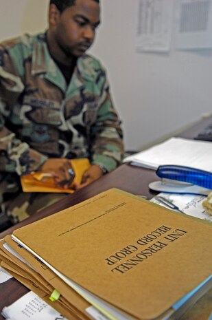 Senior Airman Alphonso Moseley reviews personnel records at the Military Personnel Flight at Charleston AFB June 5 at 10:58 a.m., 1458 ZULU. Airman Moseley is a personnel specialist with the 437th Force Support Squadron. (U.S. Air Force photo/Senior Airman Ali E. Flisek)