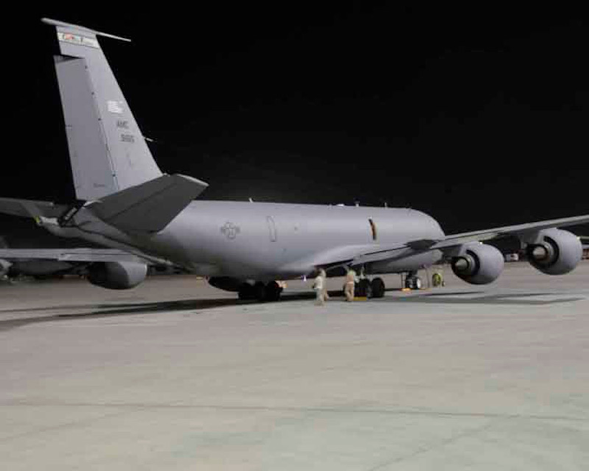 Airmen with the 379th Expeditionary Security Forces Squadron keep a watchful eye on a KC-135 Stratotanker as night shift maintainers work May 29 in Southwest Asia. (U.S. Air Force photo/Senior Airman Domonique Simmons) 
