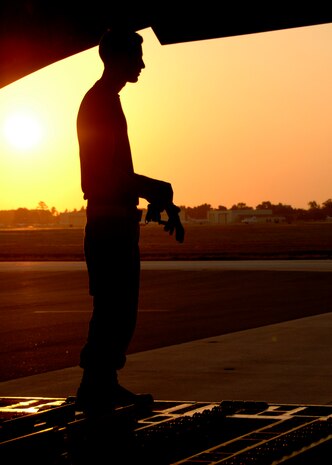 Senior Airman Johnathan Lemond prepares to load a C-17A Globemaster III at 7 a.m., 1100 ZULU, on the Charleston AFB flightline June 5. Airman Lemond is an air transportation journeyman for the 437th Aerial Port Squadron. (U.S. Air Force photo/Airman 1st Class Timothy Taylor)