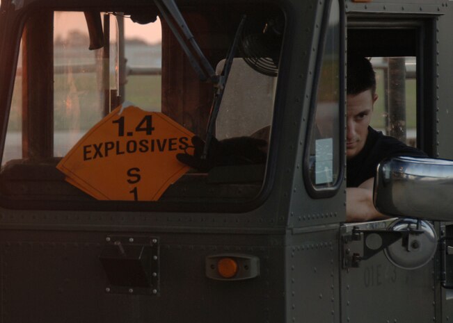 Senior Airman Johnathan Lemond positions a 60K Tunner to the rear of a C-17A Globemaster III at 6:45 a.m., 1045 ZULU, on the Charleston AFB flightline June 5. Airman Lemond is an air transportation journeyman with the 437th Aerial Port Squadron. (U.S. Air Force photo/Airman 1st Class Timothy Taylor)
