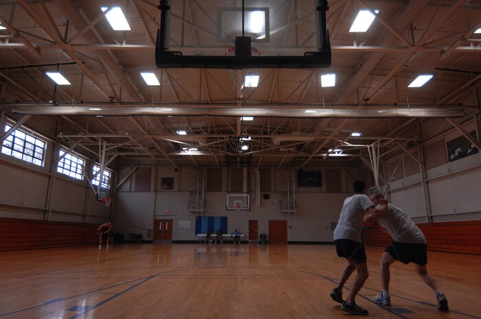 Airmen 1st Class David Glessing and Justin Hoffman play a game of basketball at the Fitness and Sports Center on CharlestonAFB June 4 at 3:15 p.m., 1915 ZULU. Airmen Glessing and Hoffman are from the 437th Aircraft Maintenance Squadron. (U.S. Air Force photo/Staff Sgt. Jason Robertson)