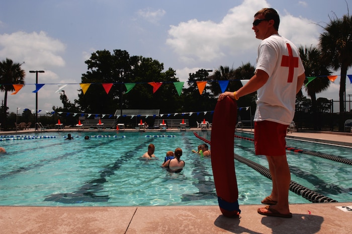 Lifeguard Rick Hallett looks over the safety of military and family members enjoying a swim at the 437th Force Support Squadron swimming pool on Charleston AFB June 4 at 4:45 p.m., 2045 ZULU. (U.S. Air Force photo/Staff Sgt. Jason Robertson)