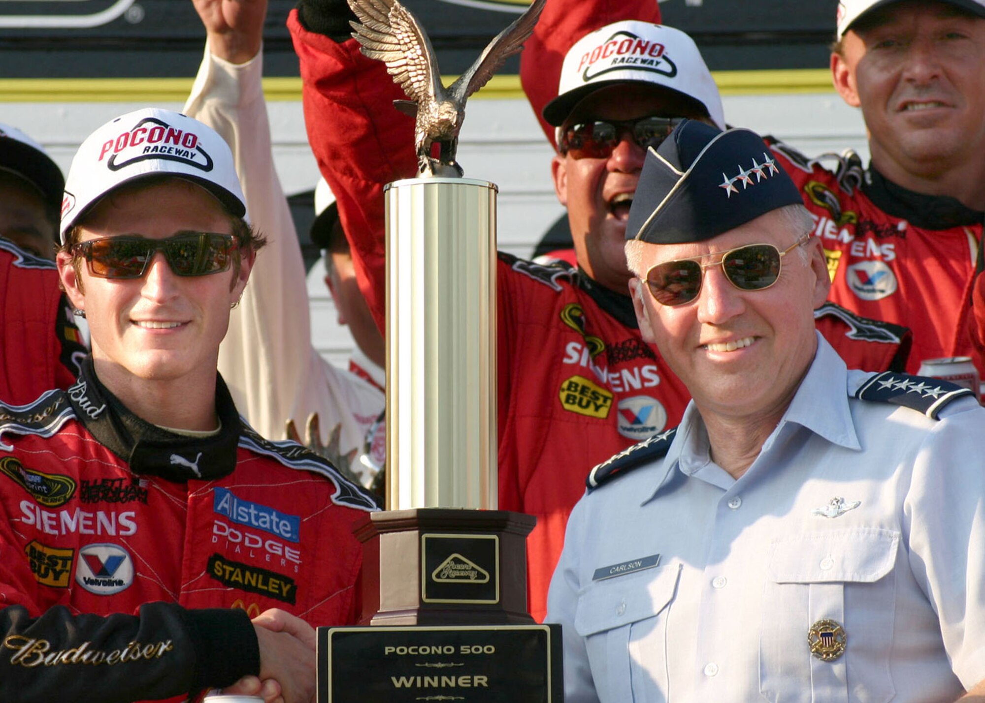 Kasey Kahne, winner of the 2008 Pocono 500, accepts his trophy and congratulations from Gen. Bruce Carlson, commander of Air Force Materiel Command. The race took place June 8 in Pennsylvania. (U.S. Air Force photo/ Dale Eckroth)