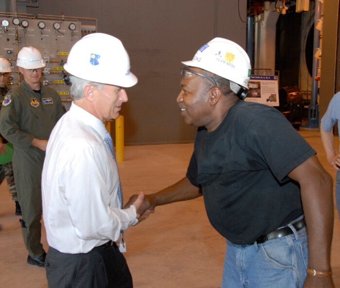 U.S. Sen. Bob Corker greets John Long in the Sea Level SL-3 facility during the senator’s tour of Arnold Engineering Development Center Monday. (Photo by David Housch)