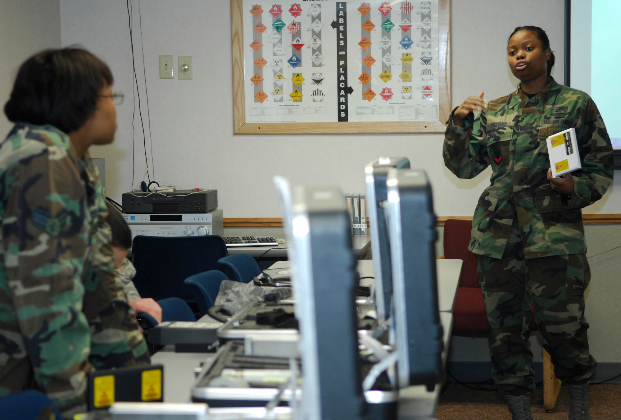 MINOT AIR FORCE BASE, N.D. – Senior Airman Danyette Williams, emergency management journeyman with the 5th Civil Engineer Readiness and Emergency Management Flight, gives detailed instructions on performing a preventive maintenance check inspection on an ADM-300 radiac meter here recently. The ADM-300 radiac meter detects radiation and is inspected bi-annually to ensure it functions properly. (U.S. Air Force photo by Staff Sgt. Thomas Dow)