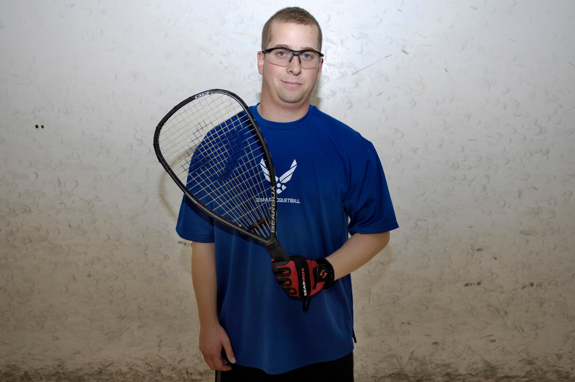 VANDENBERG AIR FORCE BASE, Calif. --  Tech. Sergeant Reid Percivalle stands with his racqetball racket inside a racqetball court here recenlty. Sergeant Percivalle won the U.S. National Racquetball championship men’s military 30+ division on May 21 through 26, in Houston, Texas. Sergeant Percivalle used 25 years of racquetball experience to win first place over 16 other military individuals. (U.S. Air Force photo/Airman 1st Class Jonathan Olds)