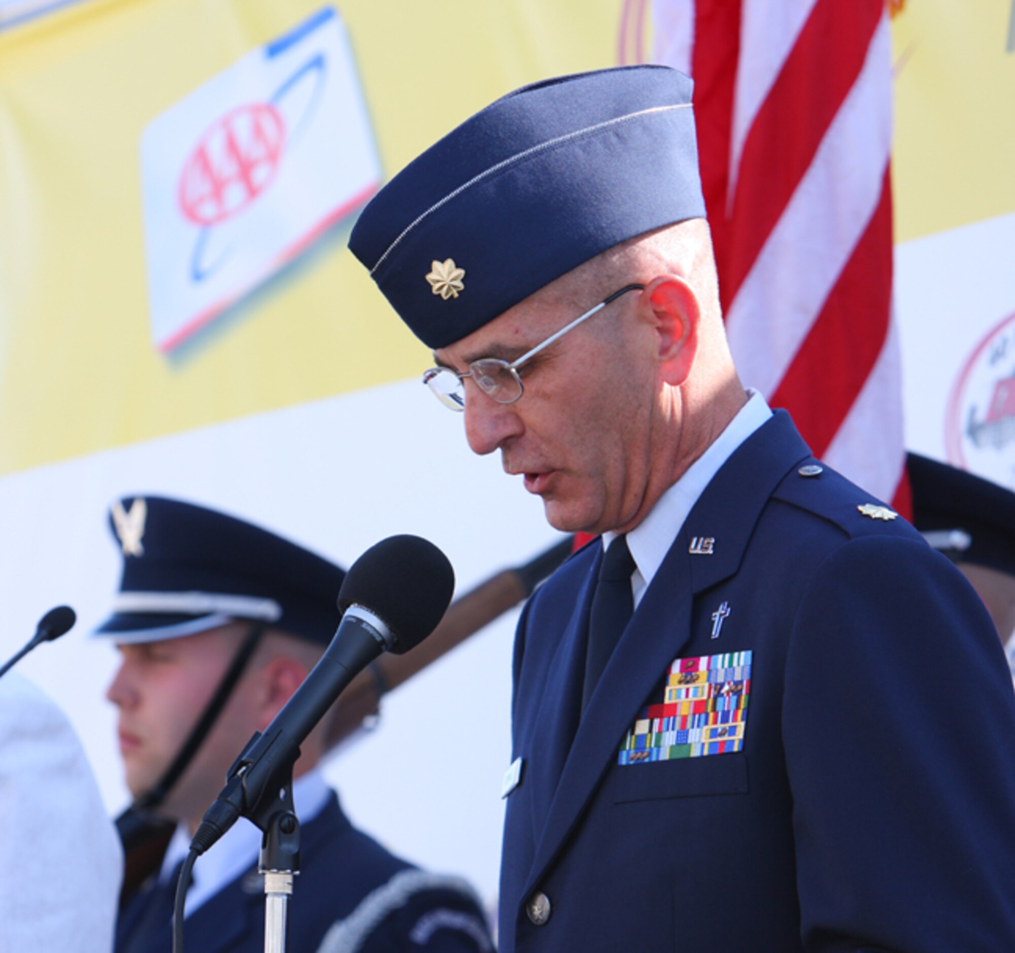 Chaplain (Maj.) Scott Rummage, 436th Airlift Wing, reads the invocation to start off NASCAR race weekend at Dover Downs International Speedway May 30.  (U.S. Air Force Photo/Roland Balik)