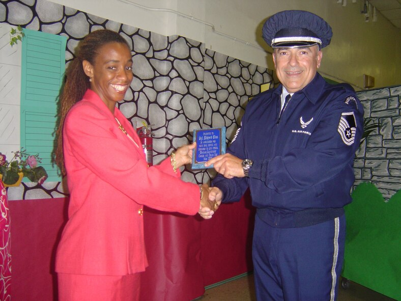 Master Sgt. Richard Rios, 482nd Communications Squadron senior air reserve technician, is presented a plaque by the assistant principal of Hialeah Elementary School in appreciation for supporting the school’s annual Career Day for the last five years. Each year, the City of Hialeah resident uses personal leave time to represent the Air Force Reserve during career days at Hialeah-area schools. (Courtesy photo)