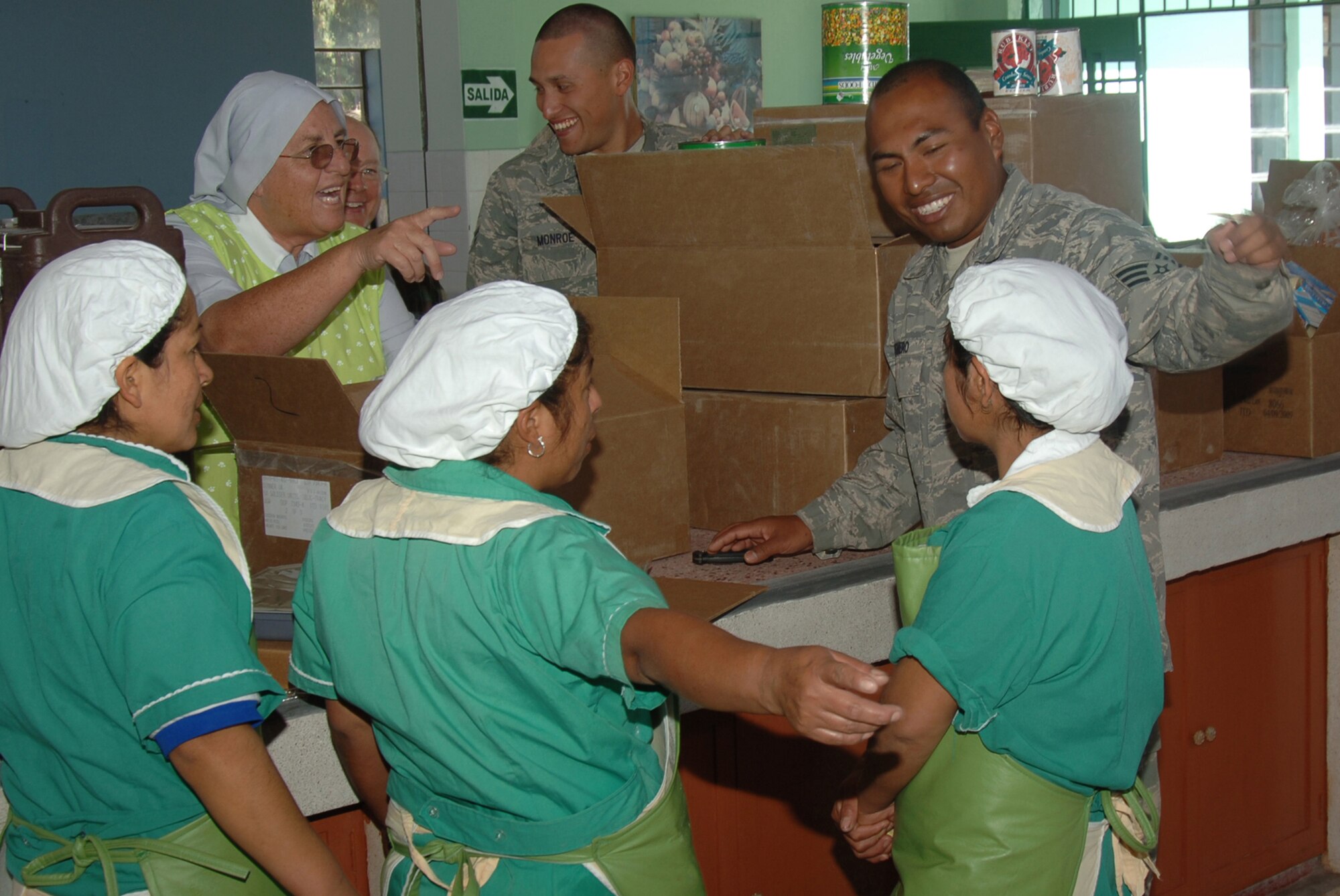 U.S. Air Force Airmen share a moment with Peruvian Catholic Nuns during their visit to the Juan Andres Vivanco Amorin Orphanage, June 9, where the U.S. military donated food to more than 180 orphaned children. U.S. Air Force, Army, Marine and Navy servicemembes are in Peru participating in New Horizons - Peru 2008, a U.S. and Peruvian partnered humanitarian mission set on providing relief to underprivileged Peruvians. (U.S. Air Force photo/Tech. Sgt. Kerry Jackson)