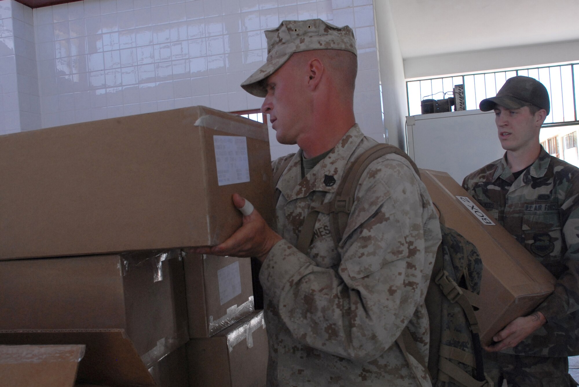 U.S. Marine Staff Sgt. Todd Bowers, a civil affairs specialist with the 4th Civil Affairs Group at Anacostia Naval Annex, District of Columbia, delivers food donated by the U.S. military, June 9, to Juan Andres Vivanco Amorin, a children’s orphanage in Ayacucho, Peru. The orphanage houses 180 boys and girls who will be affected by the support given to New Horizons - Peru 2008, a Peruvian and U.S. partnered effort to build schools, clinics, and wells for the Peruvian people. (U.S. Air Force photo/Airman 1st Class Tracie Forte)