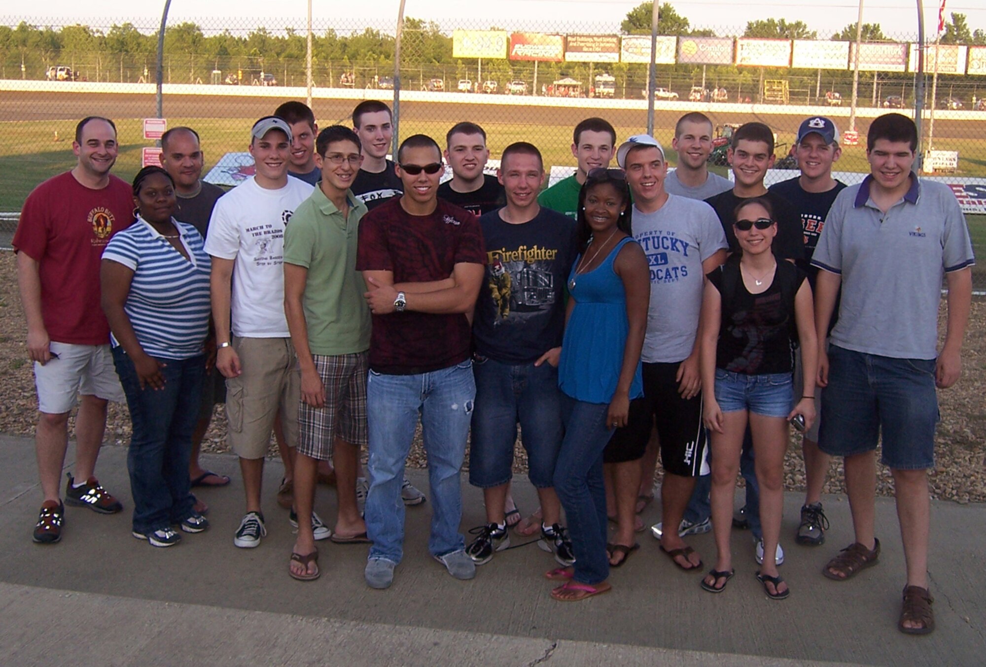 A group of Operation Air Force cadets take time for a photo Saturday while enjoying a community event at the Magnolia Motor Speedway. The cadets are introduced to Air Force life while taking part in this summer program. While at Columbus AFB, the cadets will take part in base tours, mission briefs, events in the local community and will shadow members of the BLAZE Team as they do their daily jobs. Upon completing the program the cadets will have a better appreciation for the Air Force and its mission. (U.S. Air Force photo by Sonic Johnson)