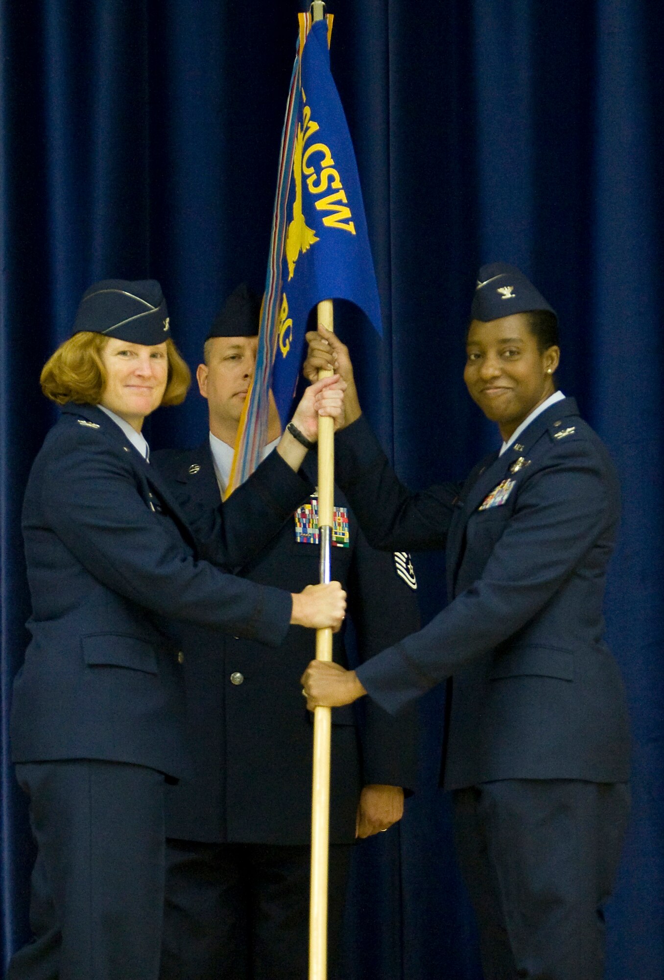 Col. Kimberly Toney, 501st Combat Support Wing commander passes the 422nd Air Base Group flag to Col. Sharon Holmes signifying Col. Holmes assumption of command over the unit on June 2.
The ceremony was attended by base military personnel, DoD civilians, State Department personnel, MOD civilians, base family members and local community leaders as well as visiting military members from throughout the United Kingdom.

