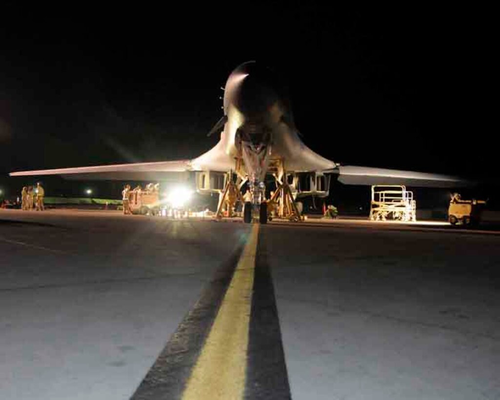 SOUTHWEST ASIA—A B-1 bomber is jacked and ready for repairs by the 37th Aircraft Maintenance Unit maintainers May 29. The maintainers use industrial lights to illuminate their workspace during the night hours. (U.S. Air Force photo/ Senior Airman Domonique Simmons)  