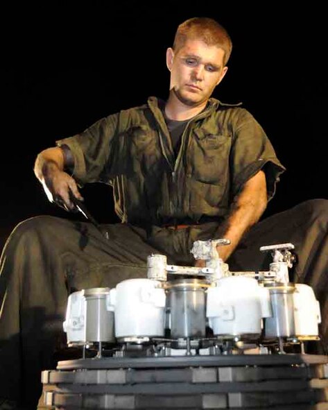 SOUTHWEST ASIA -- Airman 1st Class Jason Ripkowski, 379th Expeditionary Aircraft Maintenance Squadron, wires a brake before putting it back onto a B-1 here May 29. Airman Ripkowski is assigned to the 37th Aircraft Maintenance Unit deployed from Ellsworth Air Force Base, S.D. (U.S. Air Force photo/ Senior Airman Domonique Simmons)