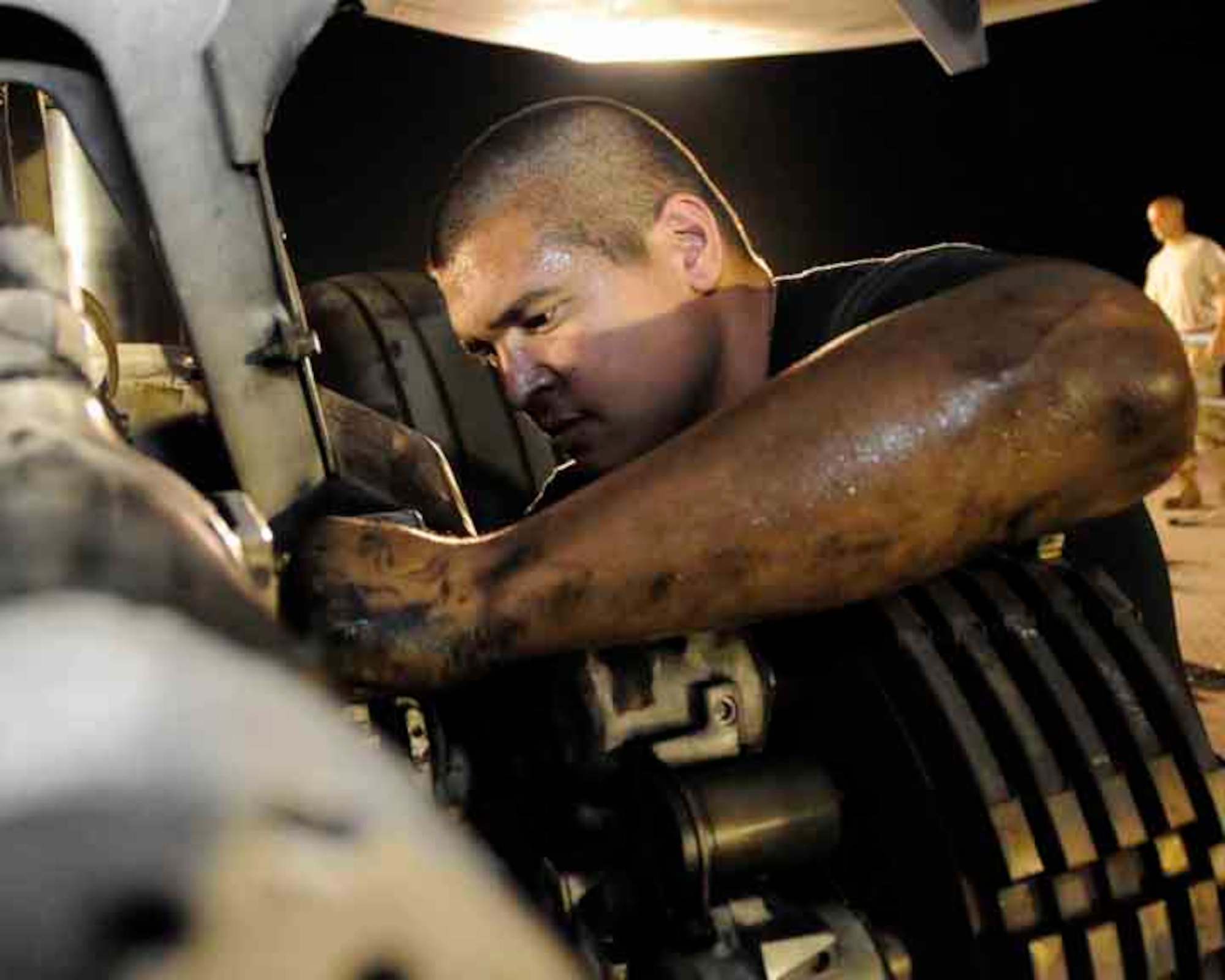 SOUTHWEST ASIA— Staff Sgt. Kendall Lizama gets all greased up repairing brake parts on a B-1 aircraft May 29. Sergeant Lizama belongs to 37th Aircraft Maintenance Unit. (U.S. Air Force photo/ Senior Airman Domonique Simmons)