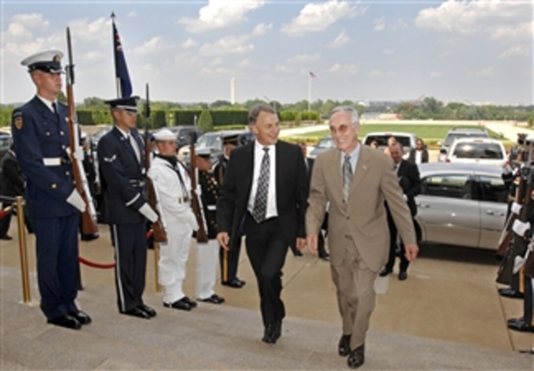 Deputy Secretary of Defense Gordon England (right) escorts New Zealand's Minister of Defence Phil Goff (left) through an honor cordon and into the Pentagon on June 9, 2008.  England and Goff will meet for bilateral security discussions.  