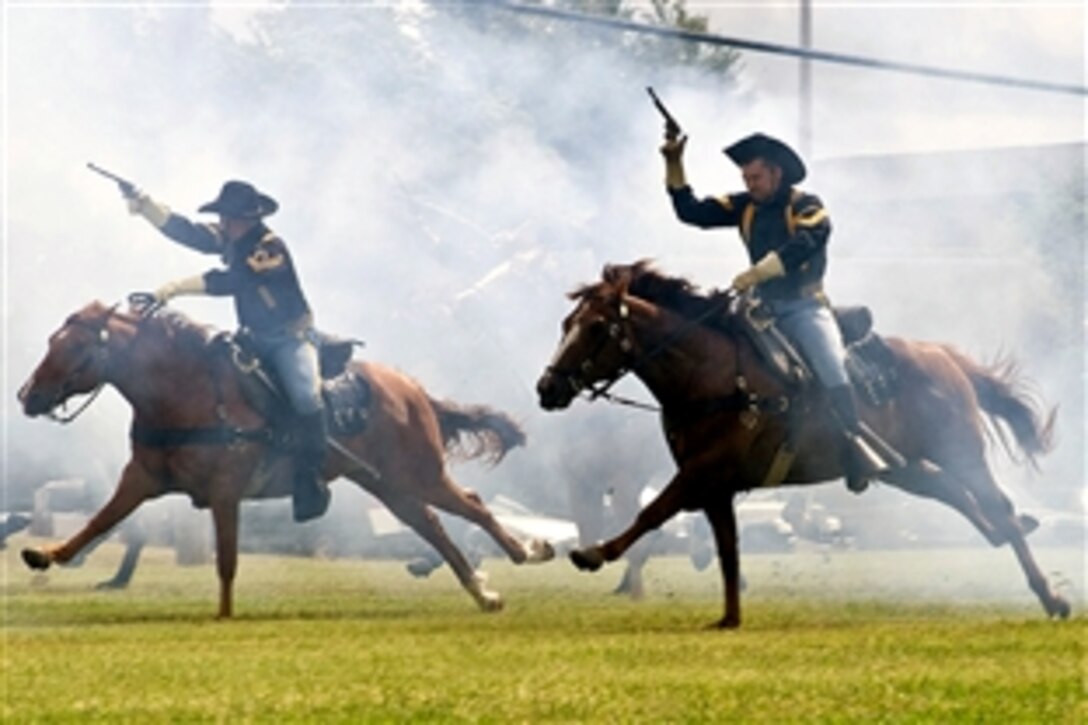 The 1st Cavalry Division's Horse Detachment charges across Cooper Field following the 4th Brigade Combat Team's casing ceremony, Fort Hood, Texas, June 4, 2008. The Long Knife Brigade is scheduled to deploy in June. 