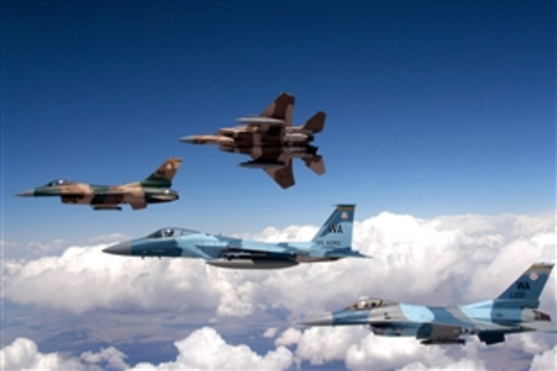 A flight of Aggressor F-15 Eagles and F-16 Fighting Falcons fly in formation, June 5, 2008, over the Nevada Test and Training Range. The jets are assigned to the 64th and 65th Aggressor squadrons at Nellis Air Force Base, Nev. 