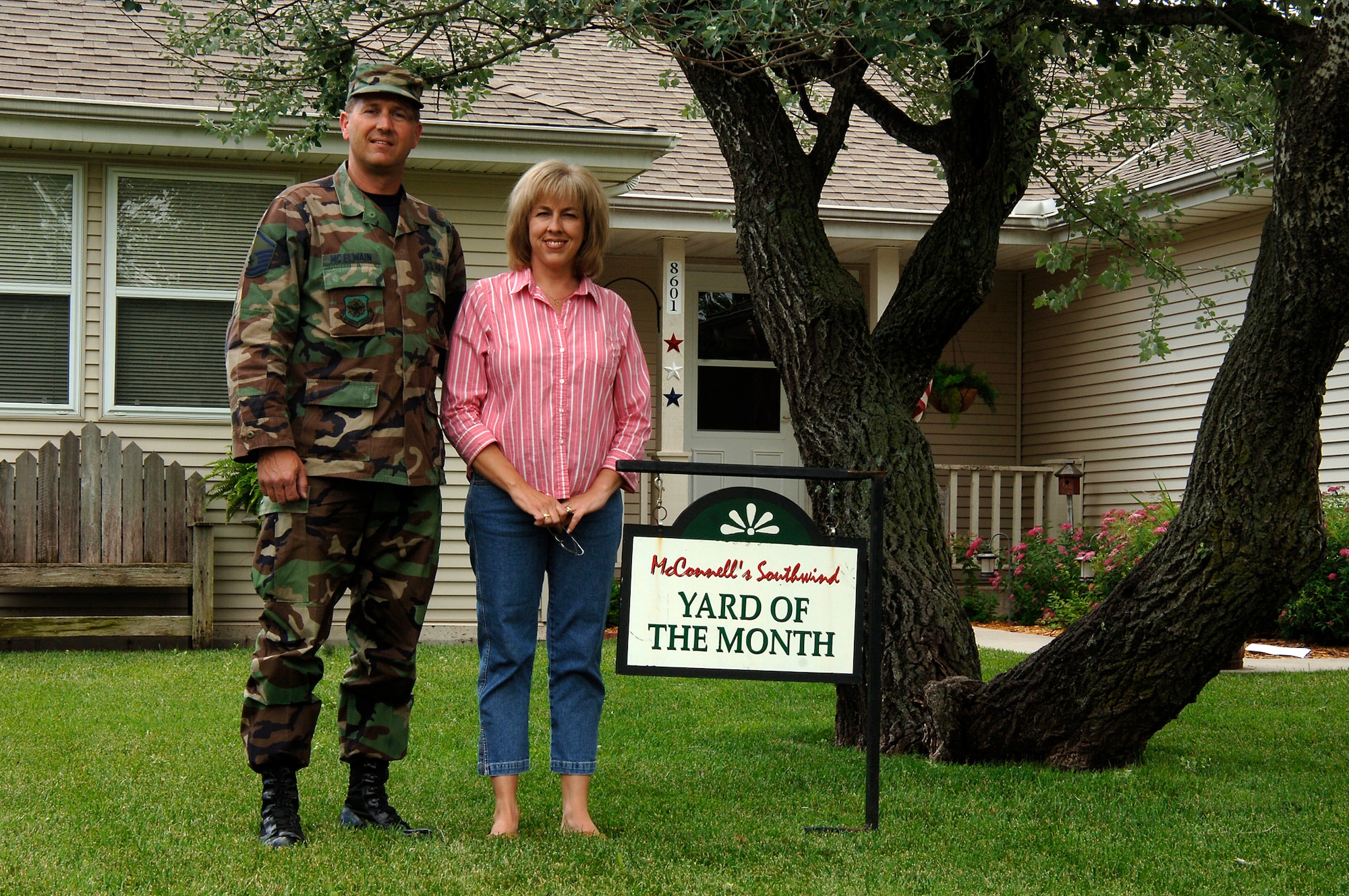 MCCONNELL AIR FORCE BASE, Kan. -- Master Sgt. Casey McElwain, 22nd Aircraft Maintenance Squadron, and his wife Jeri McElwain, receive recognition for possessing the yard of the month, for the month of May, in base housing, June 9. Sergeant McElwain and his wife were awarded multiple gifts to include a stone fountain and gardening tools for winning yard of the month. (Photo by Airman Justin Shelton)