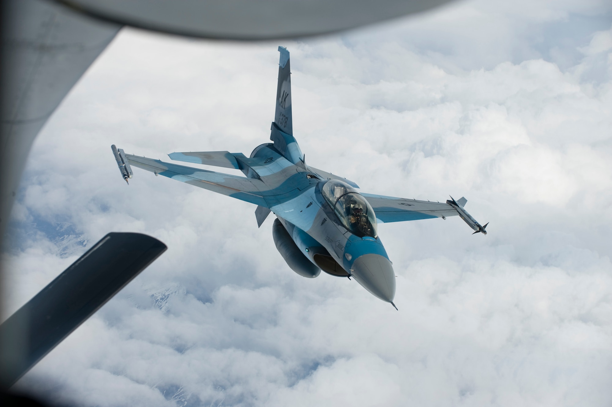 An F-16 Aggressor approaches a KC-135 Stratotanker to be refueled so he can return to the fight June 10, 2008, at Eielson Air Force Base, Alaska during RED FLAG-Alaska 08-3. The Pacific Alaskan Range Complex provides 67,000 square miles of airspace, one conventional bombing range and two tactical bombing ranges containing more than 400 different types of targets and more than 30 threat simulators, both manned and unmanned. This aircraft is assigned to the 18th Aggressor Squadron. (U.S. Air Force Photo/Airman 1st Class Jonathan Snyder)