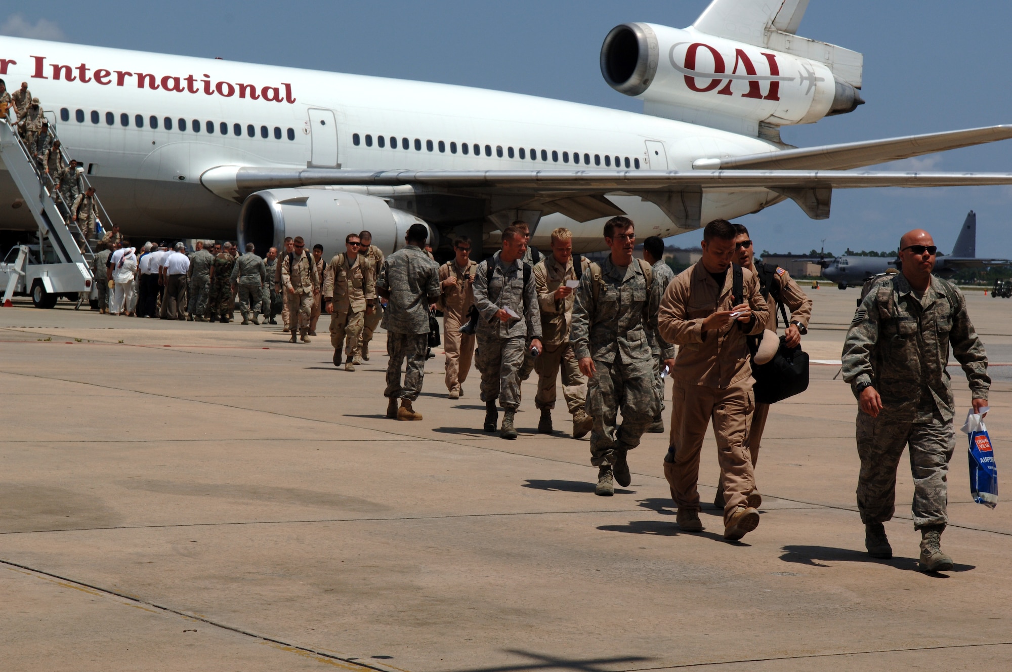 Airmen step off the plane outside Hurlburt Field's Commando Hangar June 9 after returning from deployments the Middle East. Approximately 200 returning Airmen were greeted by family, friends and colleagues at the monthly Operation Homecoming ceremony. (U.S. Air Force photo/Airman 1st Class Emily Moore)