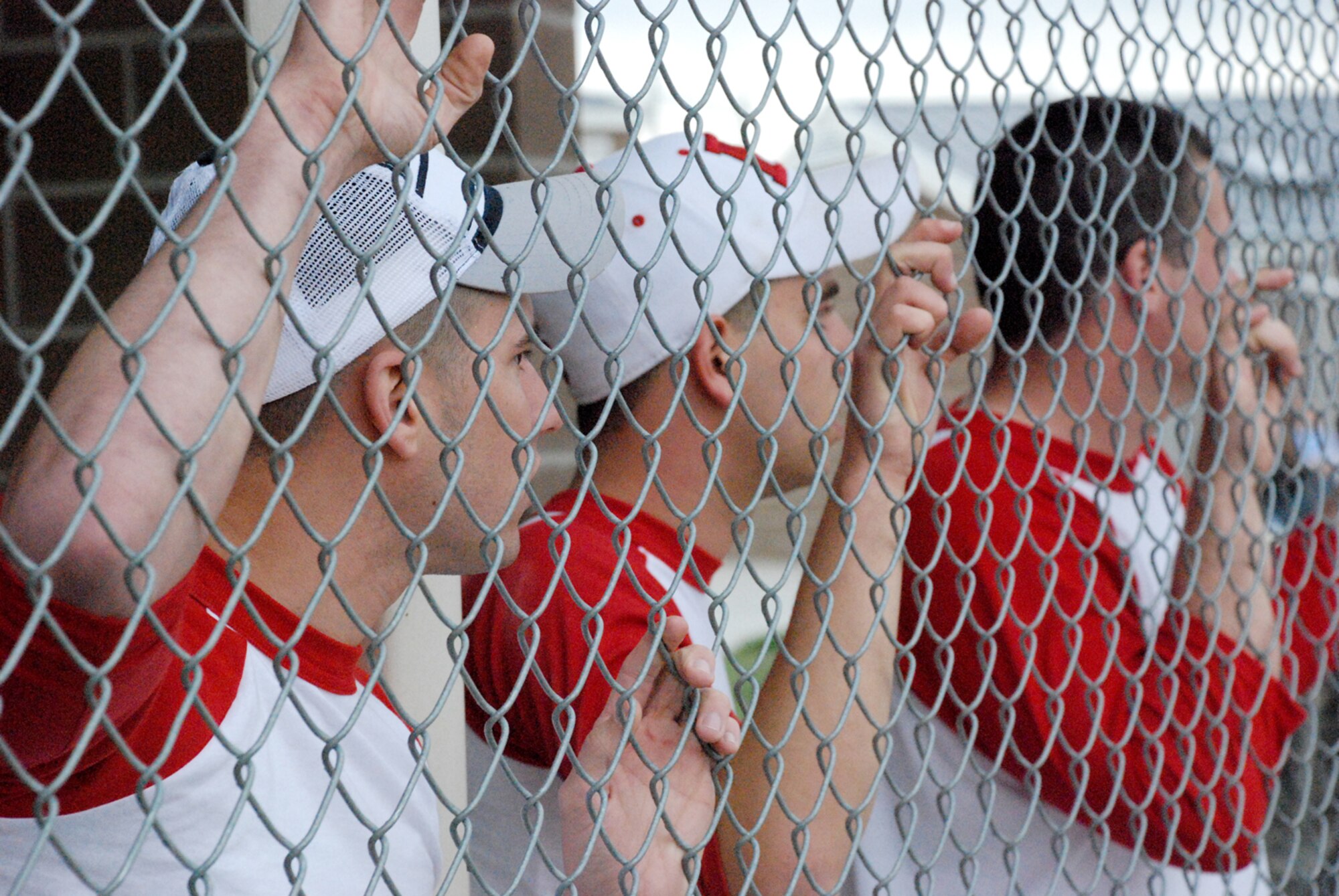 Members of the 790th Missile Security Forces Squadron softball team watch from the dugout as their team battles the 90th Maintenance Group team Tuesday in field one. The game started at 5:30 p.m. The 790th MSFS team won 17 to 9.