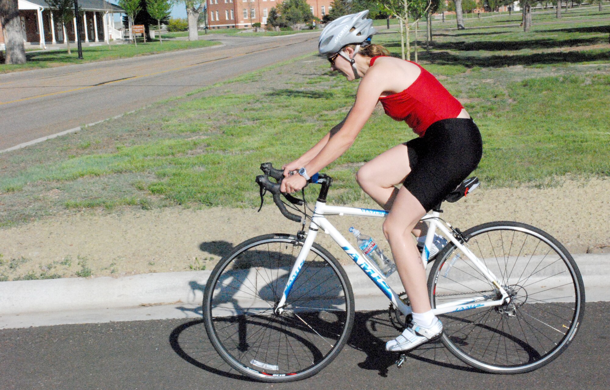Shannon Areford, wife of Master Sgt. Delbert Areford, 90th Force Support Squadron and 90th Space Wing first sergeant, begins the 12-mile bike leg of the mini triathlon. She has been training for this event, her first triathlon, for a while. Mrs. Areford placed 2nd in the 30- to 39-year-old females.