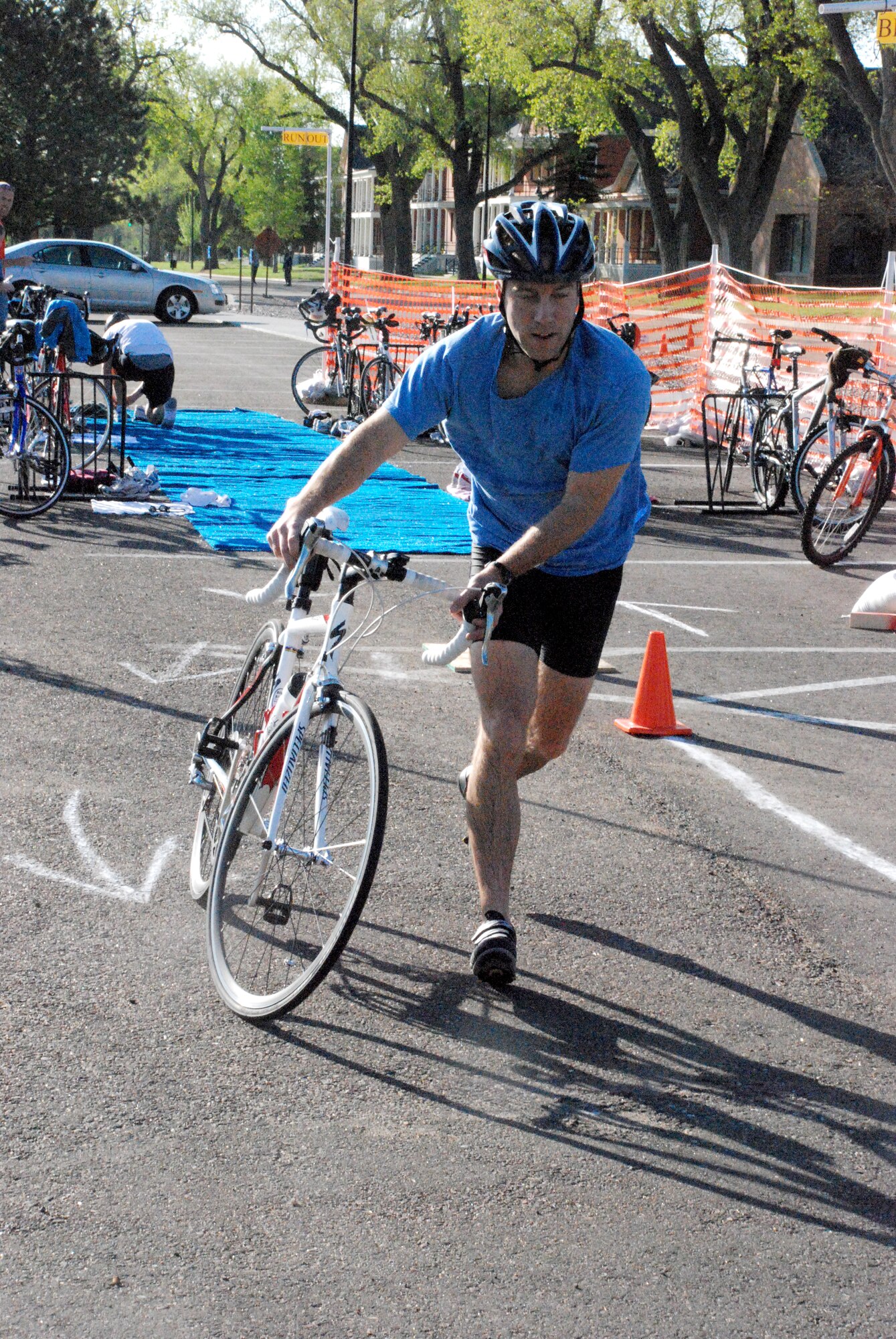 Capt. Les McPeak, 321st Missile Squadron, pulls out his bike to begin the second leg of the mini triathlon. The bike ride was 12 miles long. Participants could compete in teams of three or individually. 