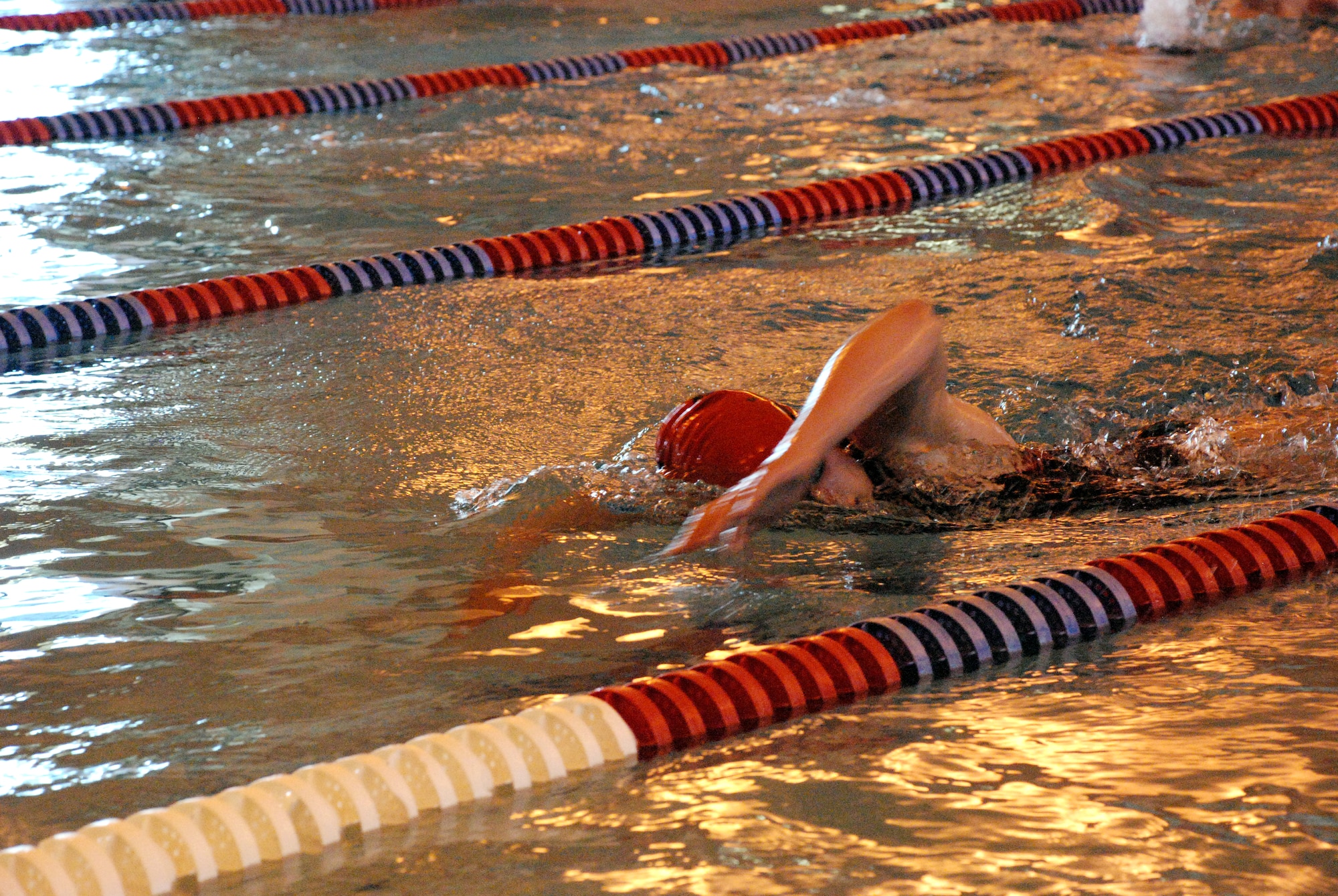 Jay Diller swims 10 lengths in the aquatic center’s 50-yard indoor pool during the mini triathlon Saturday morning. She was competing in a team with her mother, Jan Diller, doing the 12-mile bike leg and her sister, Maggie, running 2.5 miles for the final leg (Photos by 1st Lt. Lisa Meiman).