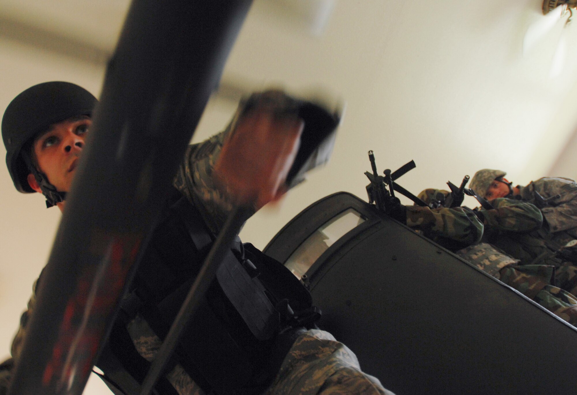 Air Force Security Forces Special Emergency Response Team member Staff Sgt. Dean Martinez uses a breeching tool to knock down a barricaded door as the rest of the SERT members await for access to the room during a counter-terrorism exercise at Eielson Air Force Base, June 9, 2008.  This training exercise is used for security forces personnel to remain current on the policies and procedures involving hostage retrieval, barricade subjects, and counter-terrorism. 
(U.S Air Force photo/Tech Sgt Eric T. Sheler)