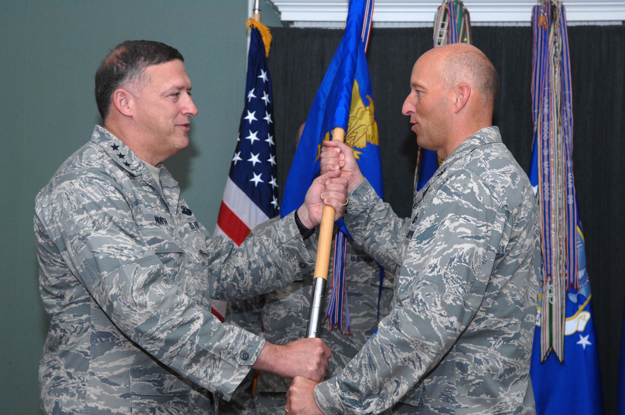 SHAW AIR FORCE BASE, S.C. -- Lt. Gen. Gary North, 9th Air Force and United States Air Forces Central commander, passes command of the 609th Air Communications Squadron to Col. Harry Blanke III during a change of command ceremony June 11 in the Carolina Skies Club. Colonel Blanke assumed command of the squadron from Col. Anthony Faughn. (US Air Force photo/Airman 1st Class Matthew Davis)

