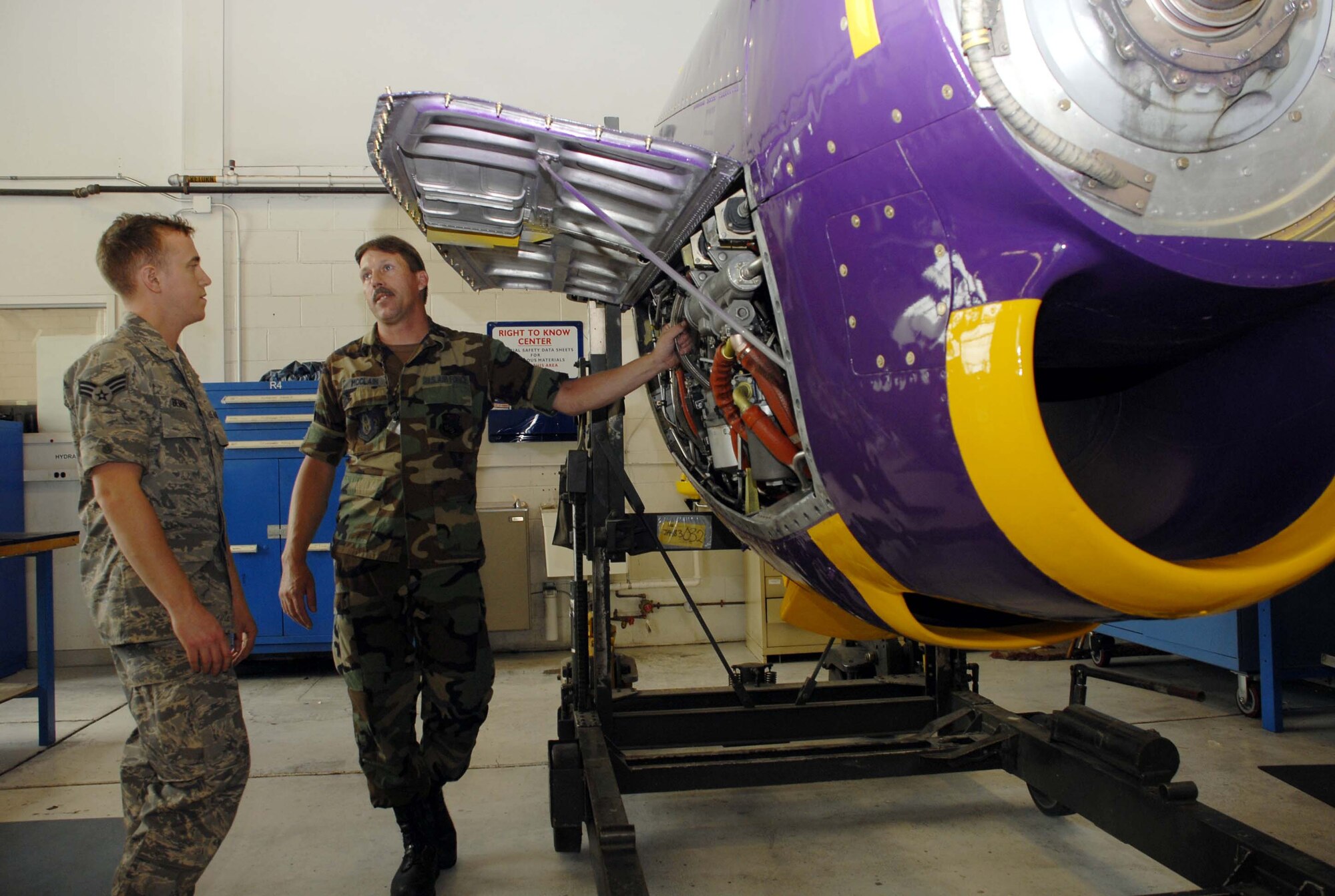Tech. Sgt. Dennis McClain (right) points out inspection points to Senior Airman Christopher Berens inside the 934th Maintenance Squadron?s new training engine.  The C-130 engine was refurbished and painted in purple and gold Flying Viking colors by members of the 934th Maintenance Squadron who will use the engine as a dedicated training tool and point of pride for the unit.

 

Photo by Master Sgt. Paul Zadach
