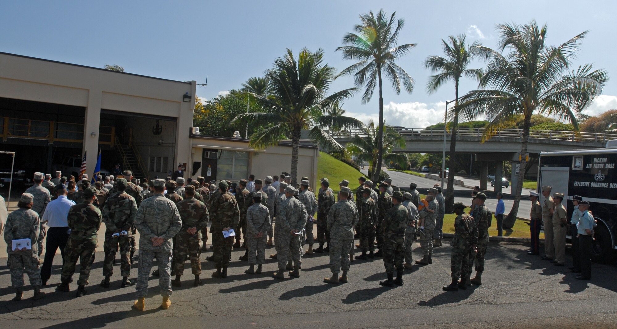 Family, friends and fellow servicemembers pay respect during a dedication ceremony in memory of Senior Airman William “Will” Newman, on June 7, 2008 at the 15th Civil Engineering Squadron Explosive Ordnance Facility.  The tribute was in honor of Newman for giving his life to protect the people of Iraq and the lives of the Soldiers and Airmen operating with him on his last mission June 7, 2007. (U.S. Air Force Photo/Master Sgt. Robert Burgess)