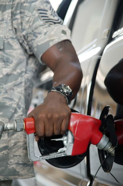 SHAW AIR FORCE BASE, S.C. -- Tech. Sgt. Jemal Jones, 20th Security Forces Squadron K-9 section kennel master, fills up his truck at the shoppette June 11. Soaring gas prices are affecting Airmen's budgets. Sergeant Jones said he and his family had to cut back on their entertainment spending to make up for the cost of fuel. (U.S. Air Force photo/Staff Sgt. John Gordinier)