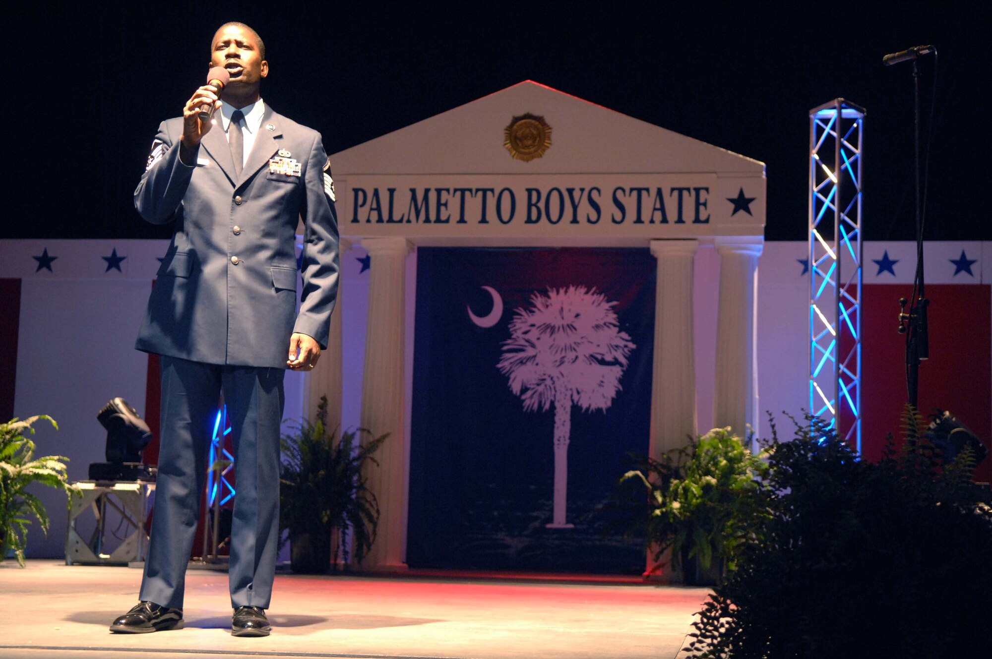 COLUMBIA, S.C. -- Master Sgt. John F. Kennedy, 20th Force Support Squadron superintendent of Airman and Family Readiness, sings "God Bless America" during the Palmetto Boys State opening ceremony June 8. Palmetto Boys State is a one-week program designed to teach young men about the governmental system and the politics that make it run. During the week, each young man will have the opportunity to run for and be elected to mock offices ranging from city level positions to state constitutional offices. Approximately 1,000 young men participated in the program founded by the American Legion. (U.S. Air Force photo/Staff Sgt. Nathan Bevier)
