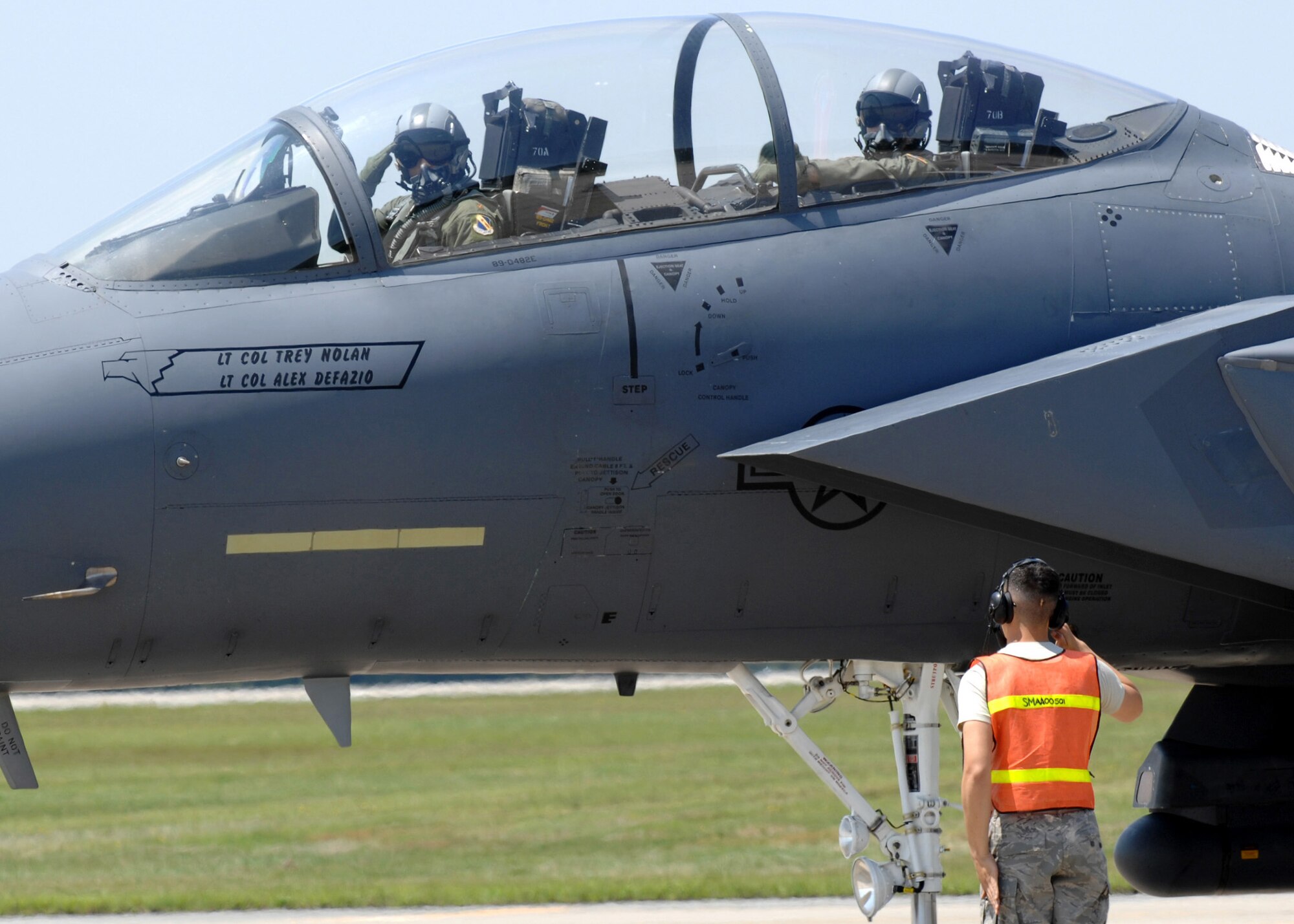 Airman 1st Class Fabian Hermosillo, 335th Aircraft Maintenance Unit, salutes the aircrew of an F-15E Strike Eagle, Seymour Johnson AFB, May 21, 2008.  A1C Hermosillo, a crew chief, works at the End of Runway where jets are inspected for last minute maintenance issues. (U.S. Air Force photo by Airman 1st Class Rae A. Henline)