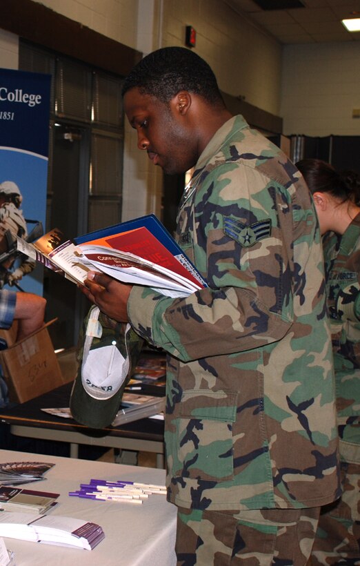 Senior Airman Lonnie Perrin, a dental technician with the 82nd Dental Squadron, researches education opportunities at the education fair May 14. This is one of many examples of the education office's efforts to help Airmen continue their education. (U.S. Air Force photo/Airman 1st Class Candy Miller)