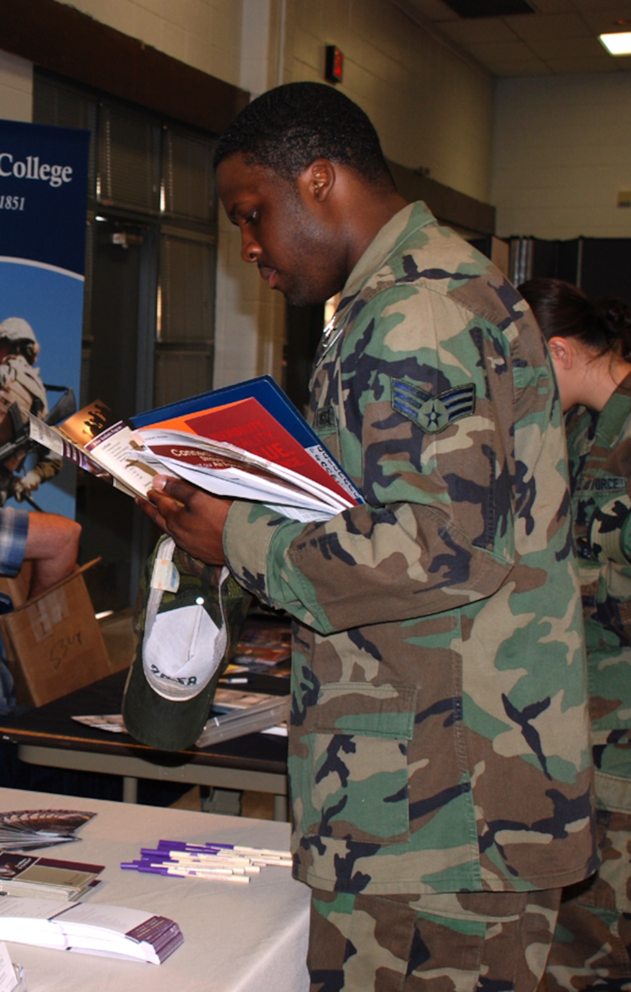 Senior Airman Lonnie Perrin, a dental technician with the 82nd Dental Squadron, researches education opportunities at the education fair May 14. This is one of many examples of the education office's efforts to help Airmen continue their education. (U.S. Air Force photo/Airman 1st Class Candy Miller)