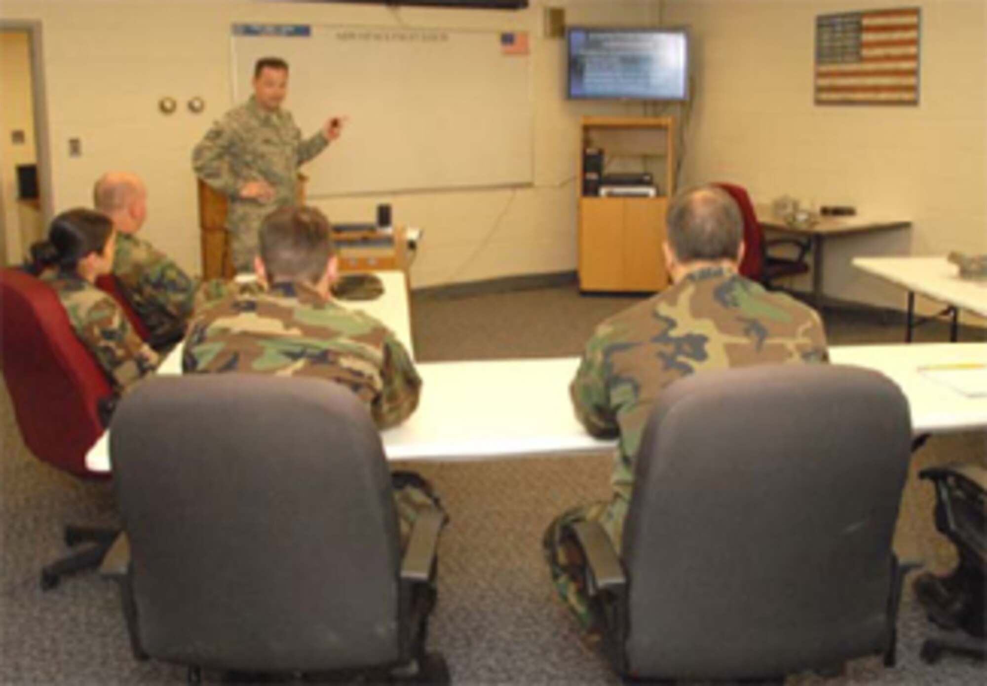 Technical Sgt. Larry T. Beach, instructor, 361st Aerospace Propulsion School, Sheppard Air Force Base, Texas, teaches the first of three 10-week jet engine mechanic training classes in a temporary schoolhouse at Bradley Air National Guard Base May 5, 2008. (U.S. Air Force Photo by Staff Sgt Nicholas A. McCorkle)
