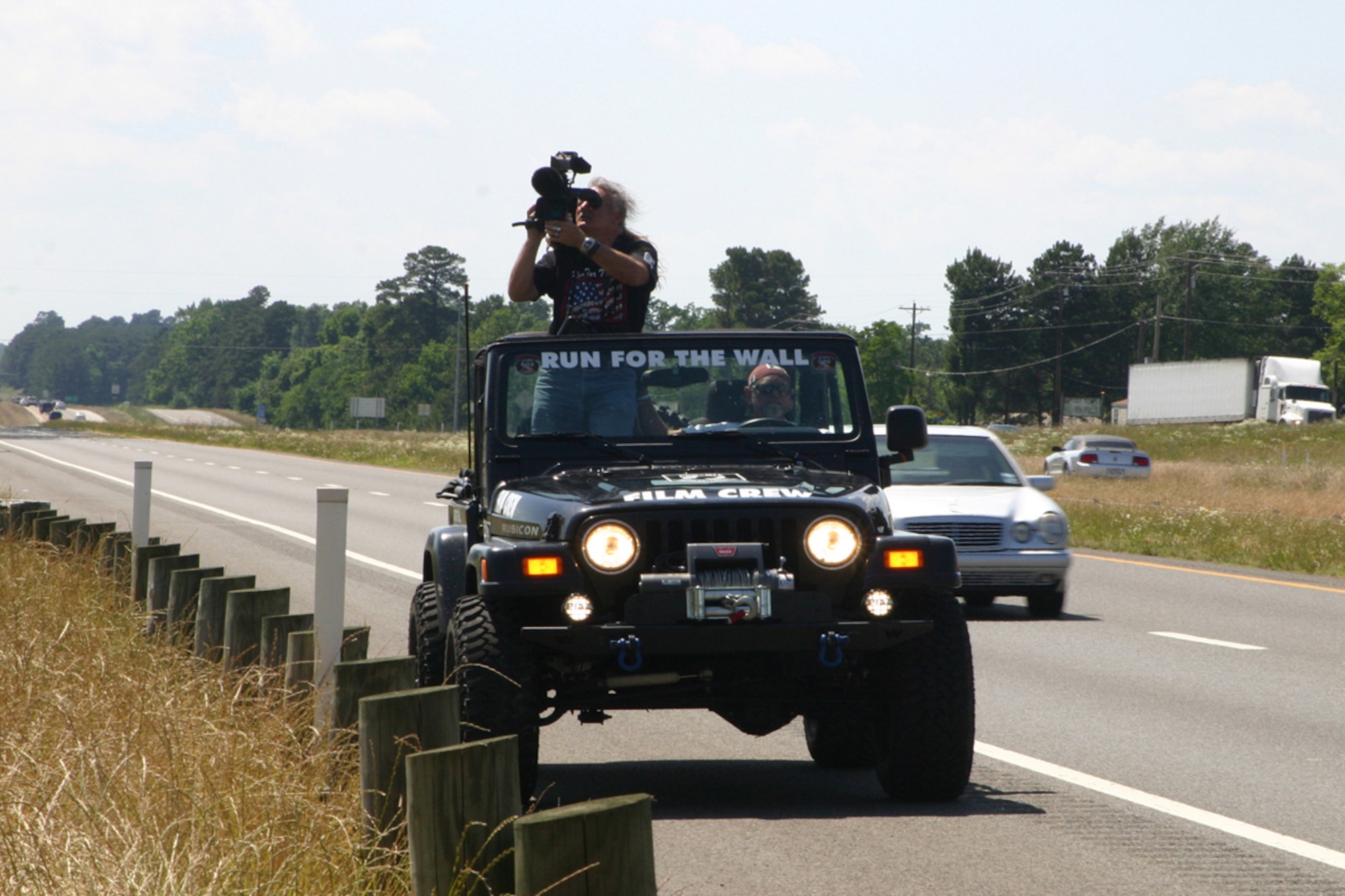 A Run For The Wall 2008 cameraman captures the emotions of supporters on a highway overpass in Waskom, Texas, Sunday, May 18, 2008. Around 300 participants in RFTW 2008 rolled down Interstate 20 past Barksdale AFB, La., on their way to the Vietnam Veterans Memorial in Washington D.C., urged on by waves and shouts from hundreds of supports who lined the overpasses and embankments from Waskom, Texas thru Bossier City, La. Members of the Barksdale Freedom Riders were on hand to lend their support to the cause. (U.S. Air Force photo/Tech. Sgt. Jeff Walston)