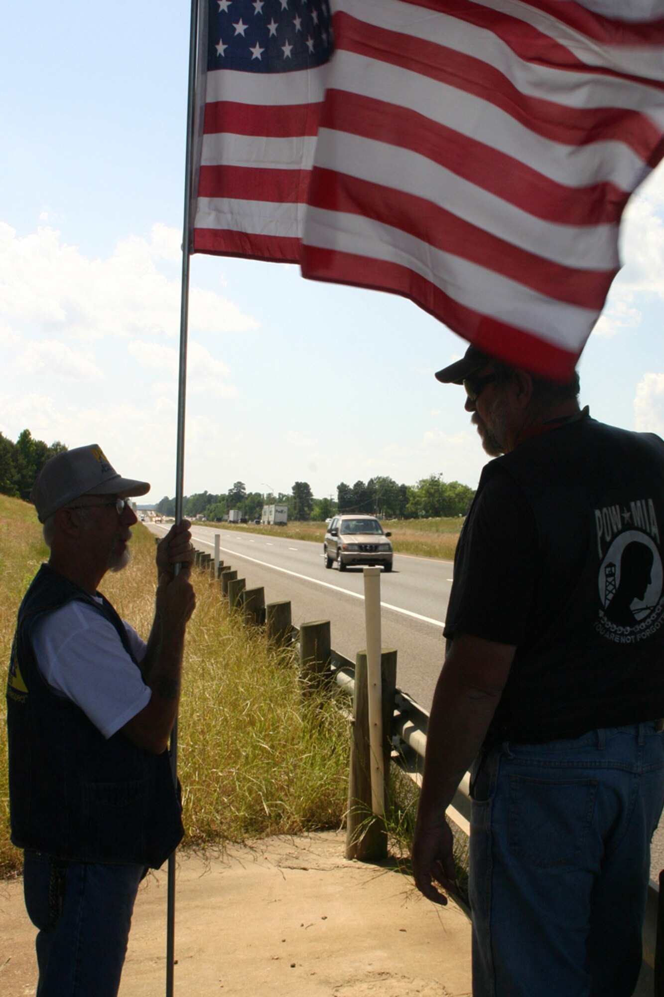 James Plumley and Michael Eubank, Patriot Guard Riders, East Texas Chapter, wait under the overpass at mile marker 633 in Waskom, Texas, for Run For The Wall 2008 riders, Sunday, May 18, 2008. Around 300 participants rolled down Interstate 20 past Barksdale AFB, La., on their way to the Vietnam Veterans Memorial in Washington D.C., urged on by waves and shouts from hundreds of supports who lined the overpasses and embankments from Waskom through Bossier City, La. Members of the Barksdale Freedom Riders were on hand to lend their support to the cause. (U.S. Air Force photo/Tech. Sgt. Jeff Walston)